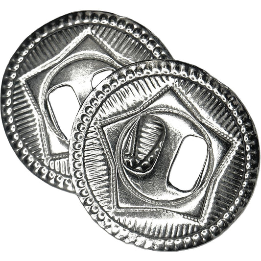 A pair of silver conchos